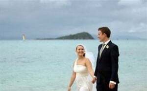 married-couple-walking-on-the-beach
